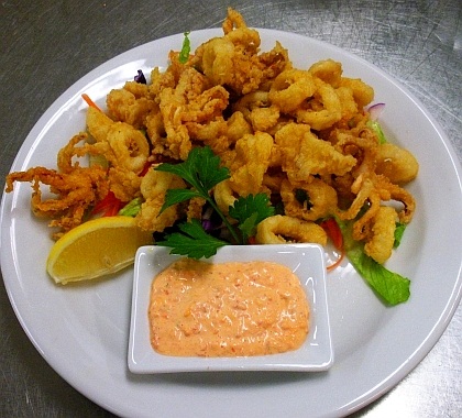 Deep-fried calamari appetizer with dipping sauce