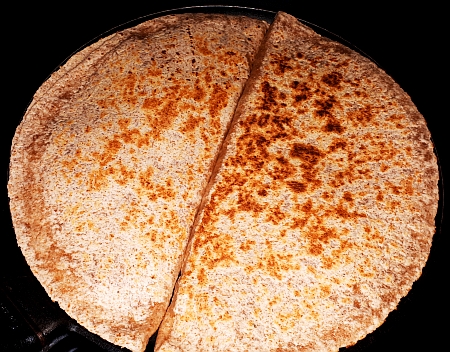 Cooking the quesadillas in a cast-iron pan