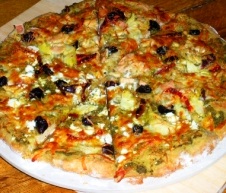 Pizza with pesto sauce and tuna